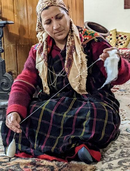 Hand spinning of wool by a Kulu Woman